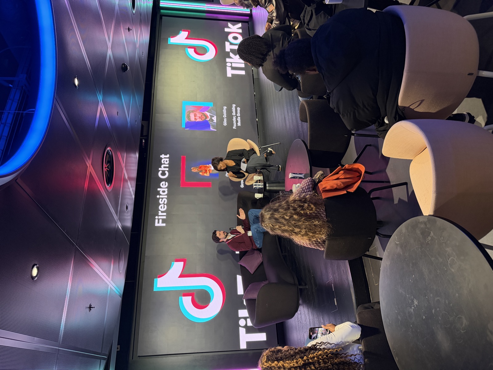 Giles Golding presenting GMG's Fireside Chat at TikTok HQ London, with TikTok branding and audience visible